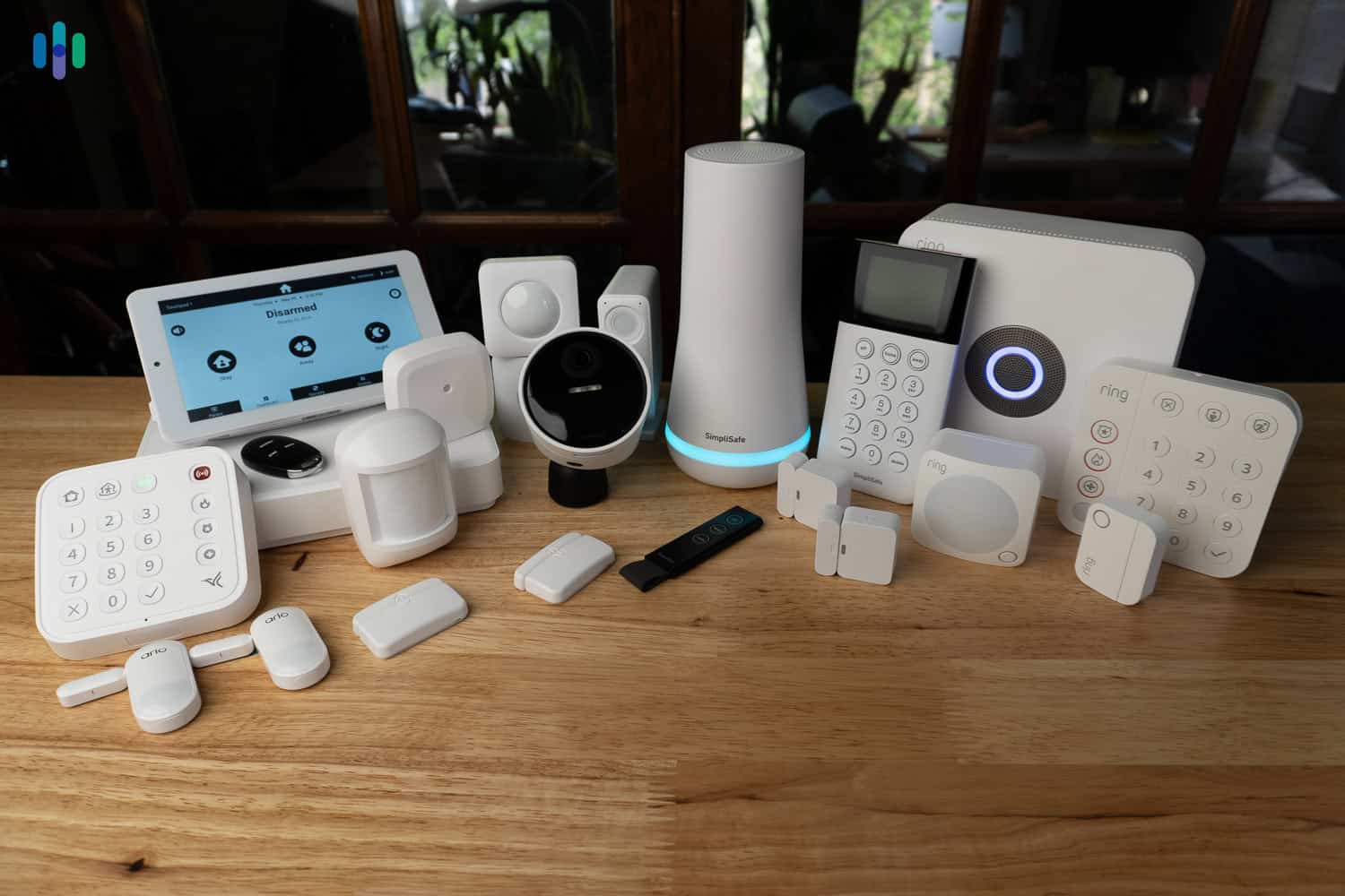 Modern wireless outdoor alarm siren on house wall